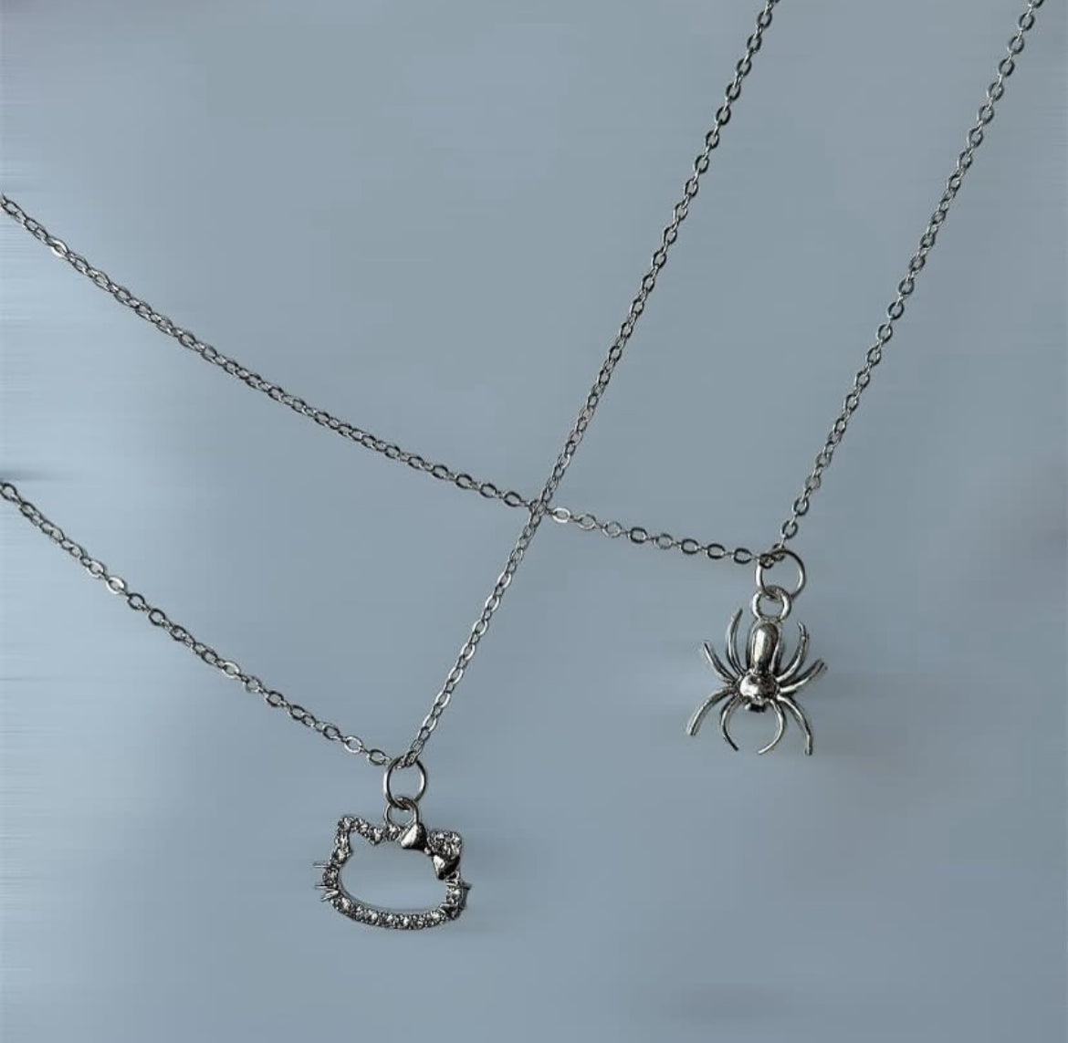 Hello kitty / spider man necklace